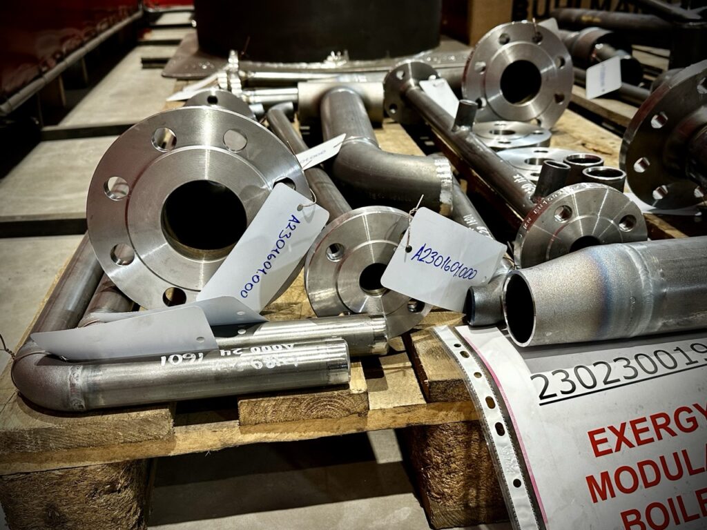 A pallet with prefabricated pipe components ready for welding and assembly in the pipe fabrication process. The prepared sections ensure efficient production and installation.